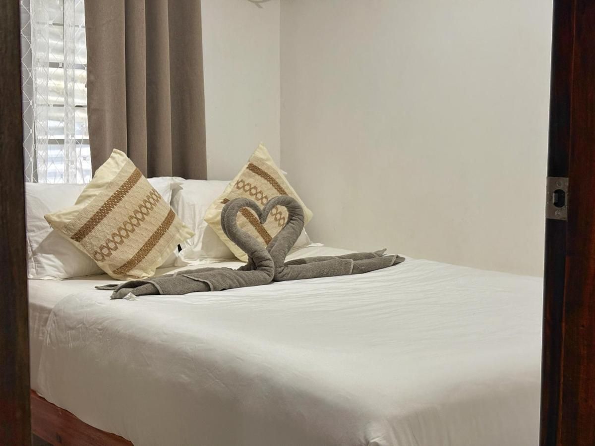 Double bed with towel swans