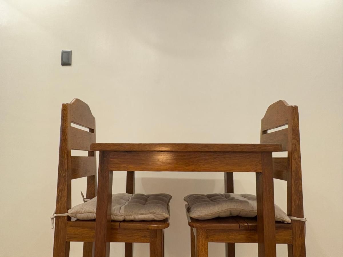 Wooden dining nook with two chairs