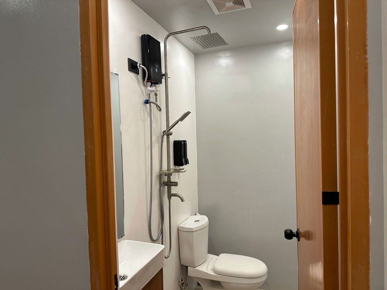 Bathroom with shower and water heater